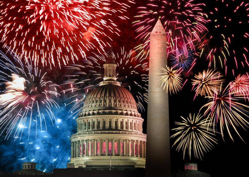 Fireworks over the capitol building and washington monument.